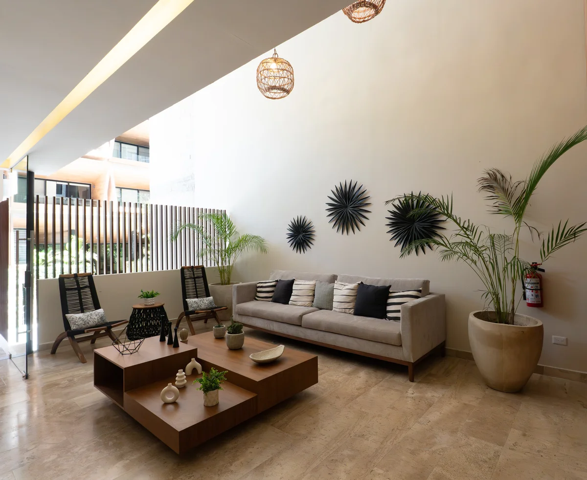 Image of a Lobby Lounge, featuring High Ceilings and Travertine Flooring.