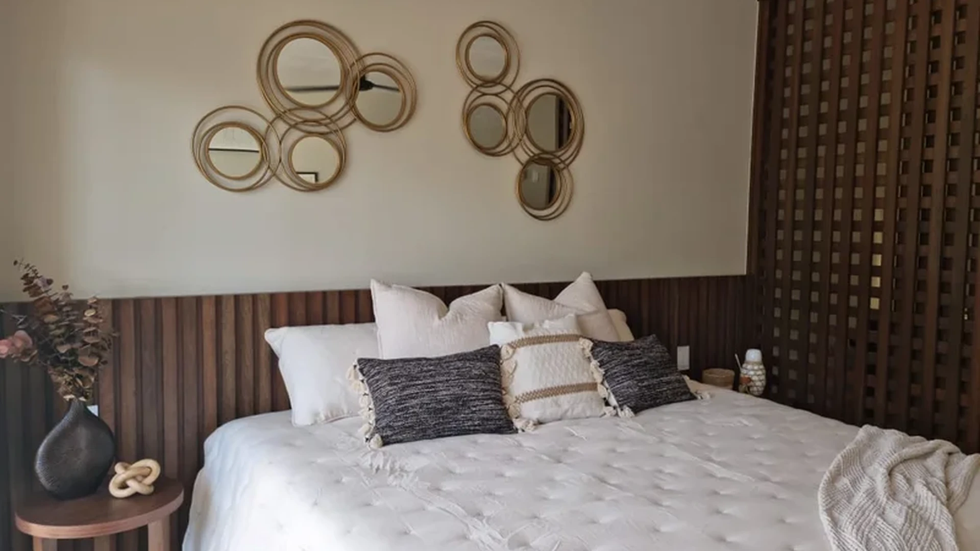 Image of a Master Bedroom, featuring Wood Accent Wall and Bohemian Style Decor.