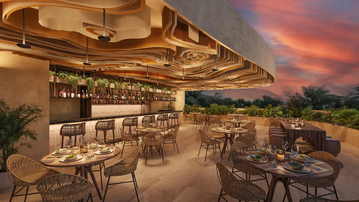 Image of a Rooftop Restaurant, featuring Al Fresco Dining and Outdoor Bar.