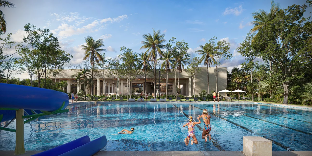 Image of a Resort-Style Pool, featuring Tropical Landscaping and Water Slide.