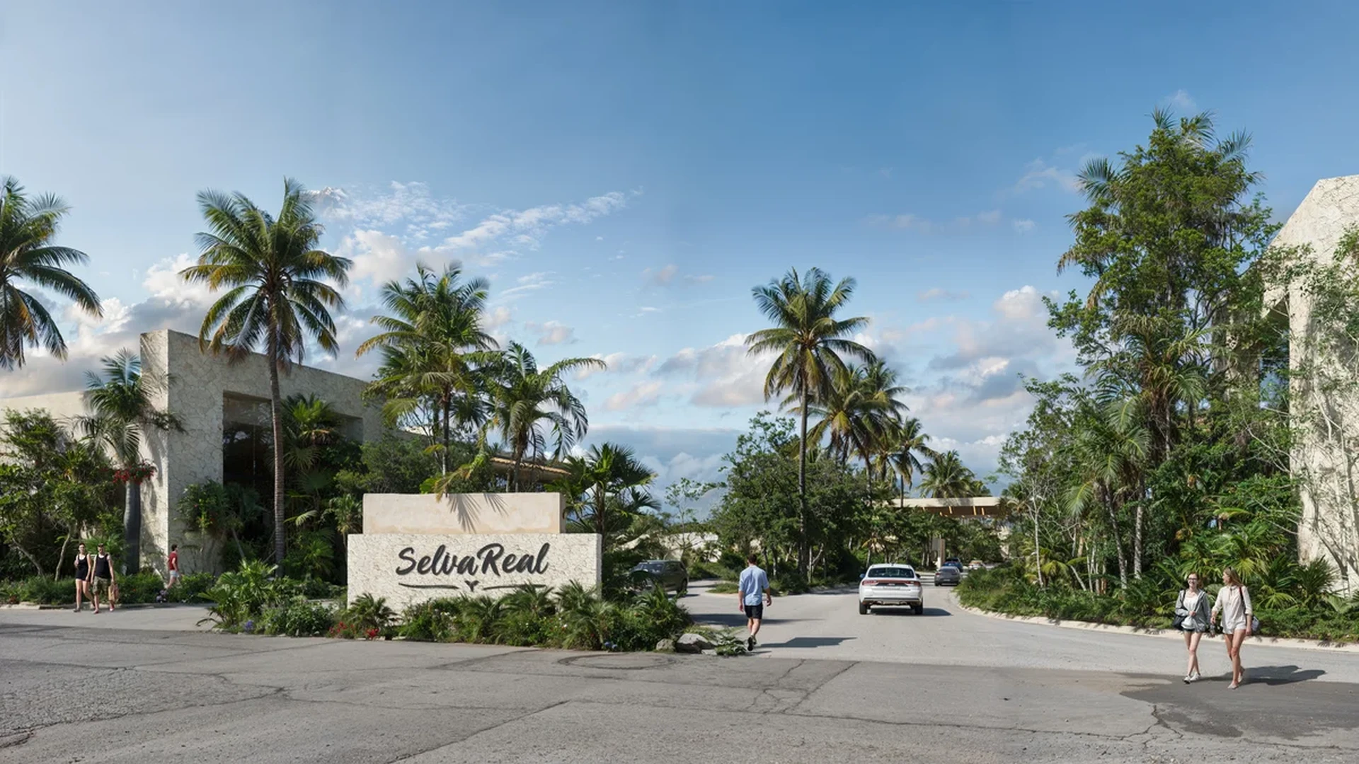 Image of a Gated Community Entrance, featuring Tropical Landscaping and Lush Greenery.