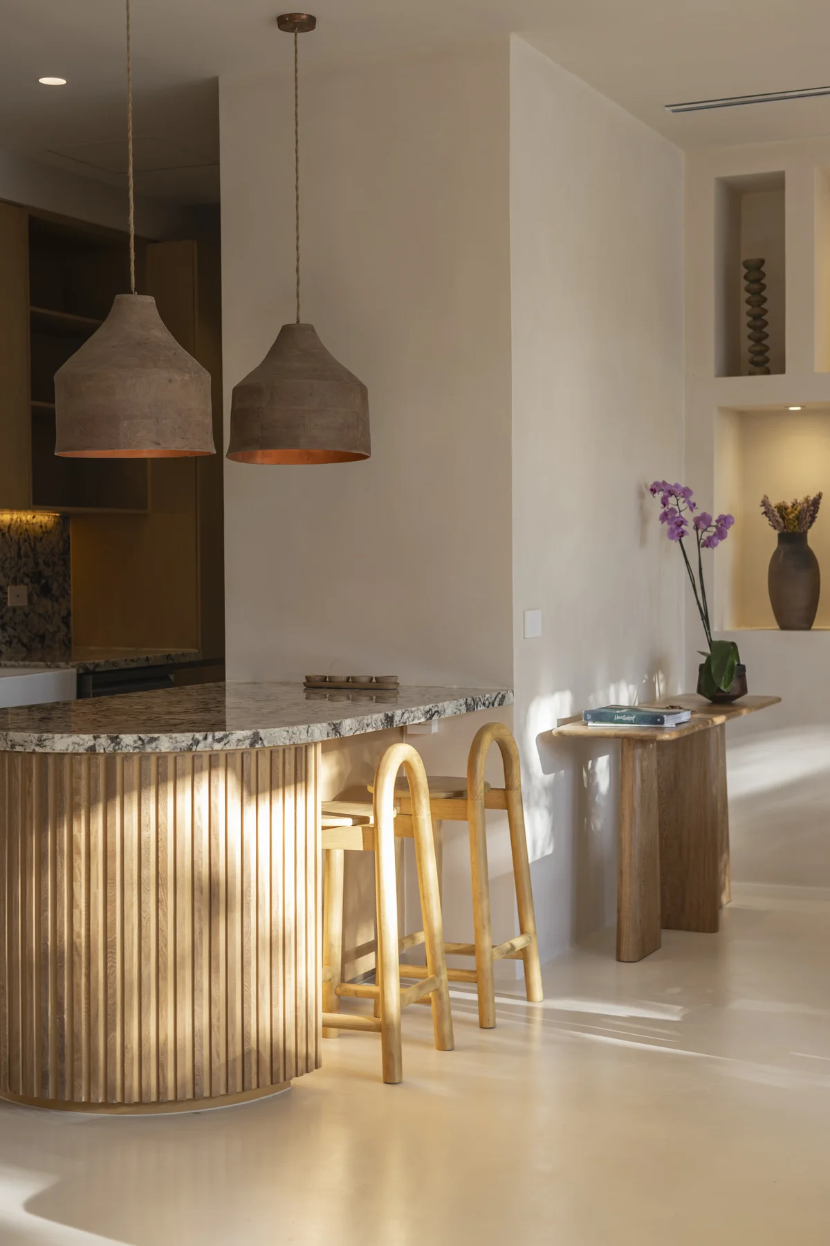 Image of a Breakfast Bar, featuring Fluted Wood Island and Granite Countertops.