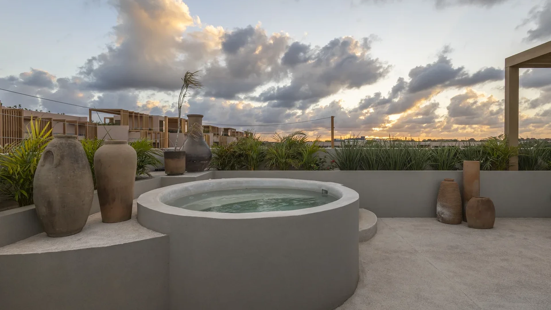 Image of a Rooftop Terrace, featuring Jacuzzi and Sunset View.