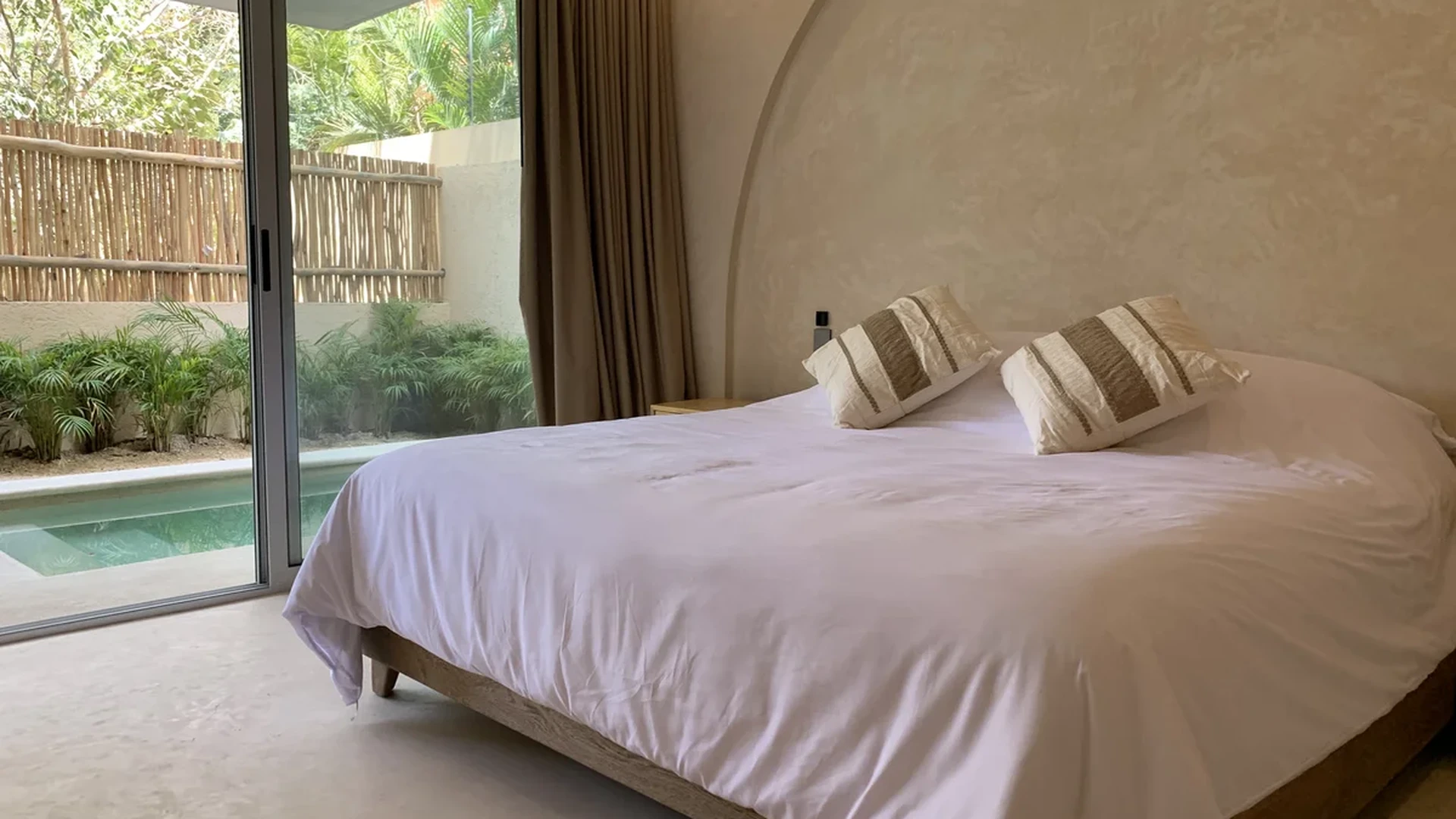 Image of a Bedroom Suite, featuring Private Plunge Pool and Indoor-Outdoor Living.