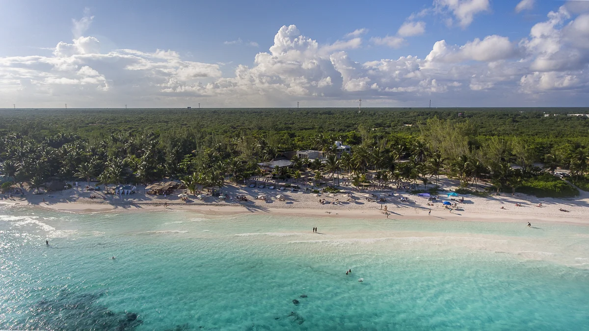 Image of a Aerial View, featuring Oceanfront Property and White Sand Beach.