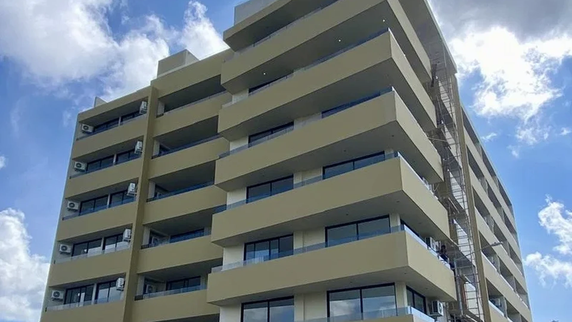 Image of a Modern Condominiums, featuring Contemporary Architecture and Private Balconies.