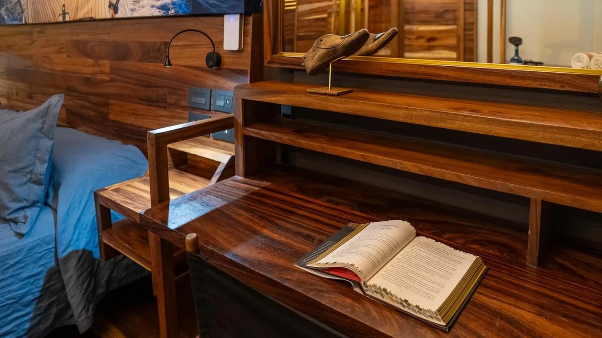 Image of a Bedroom, featuring Custom Woodwork and Rich Wood Paneling.