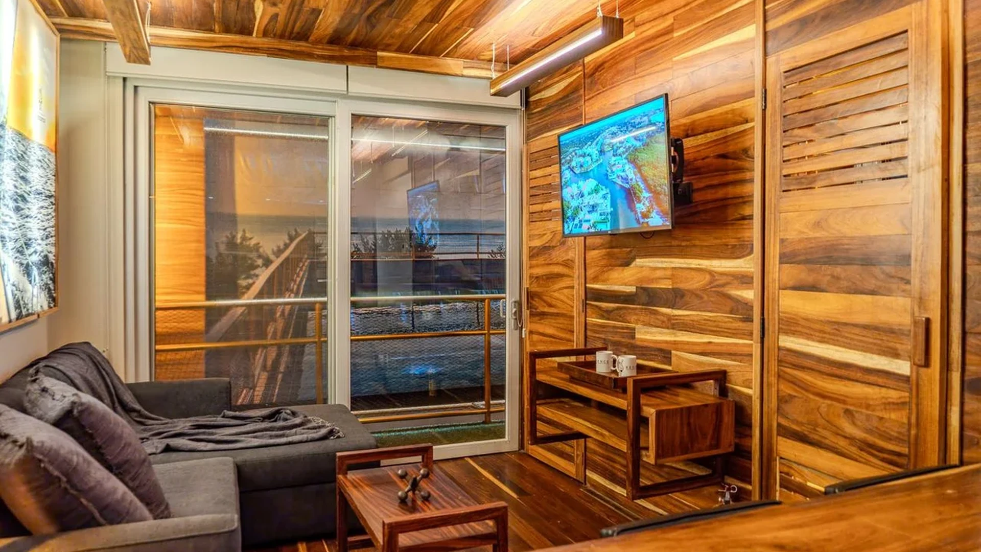 Image of a Wood Paneled Walls, featuring Hardwood Floors and Living Area.