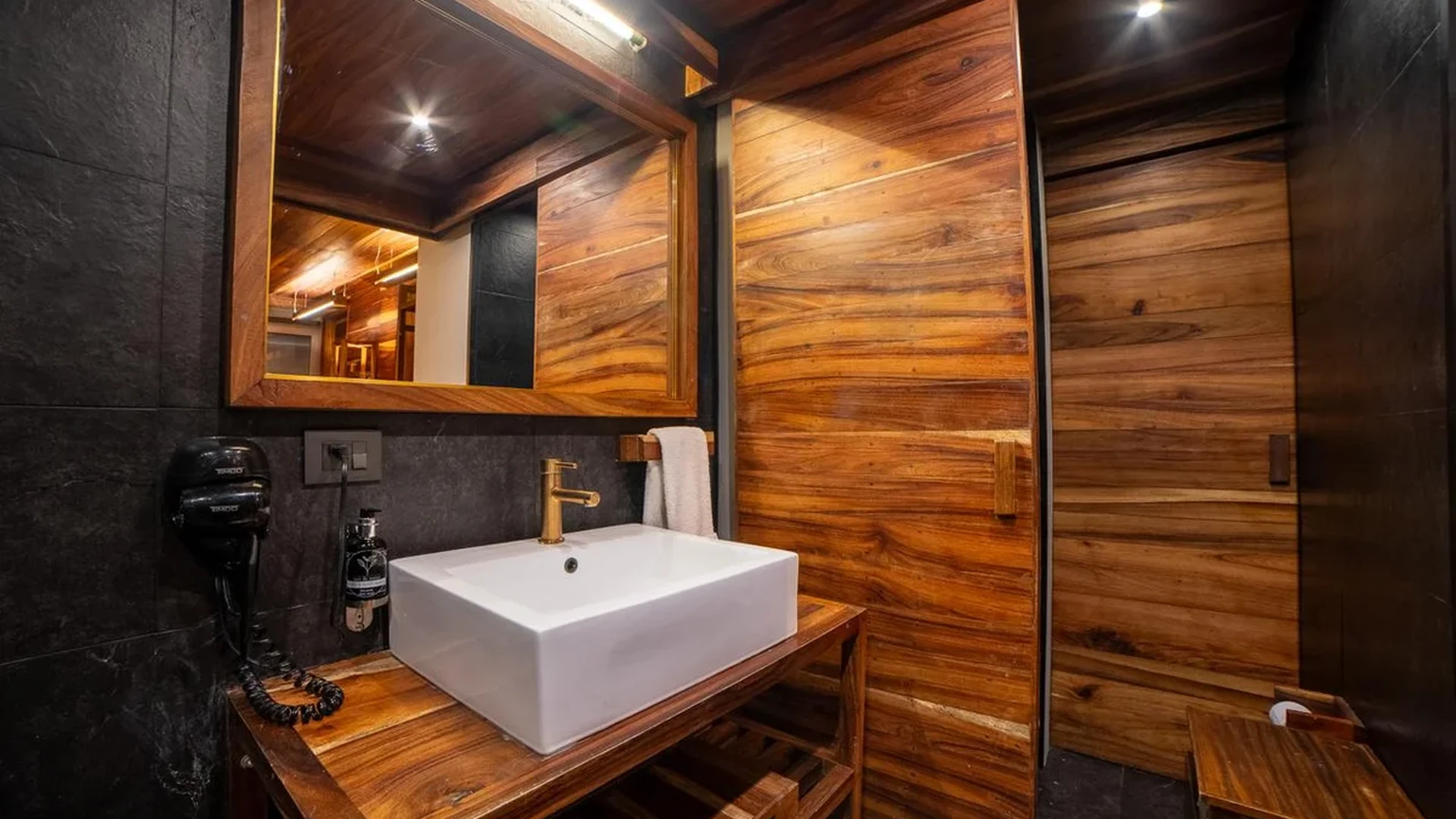 Image of a Spa-like Bathroom, featuring Custom Woodwork and Wood Paneling.