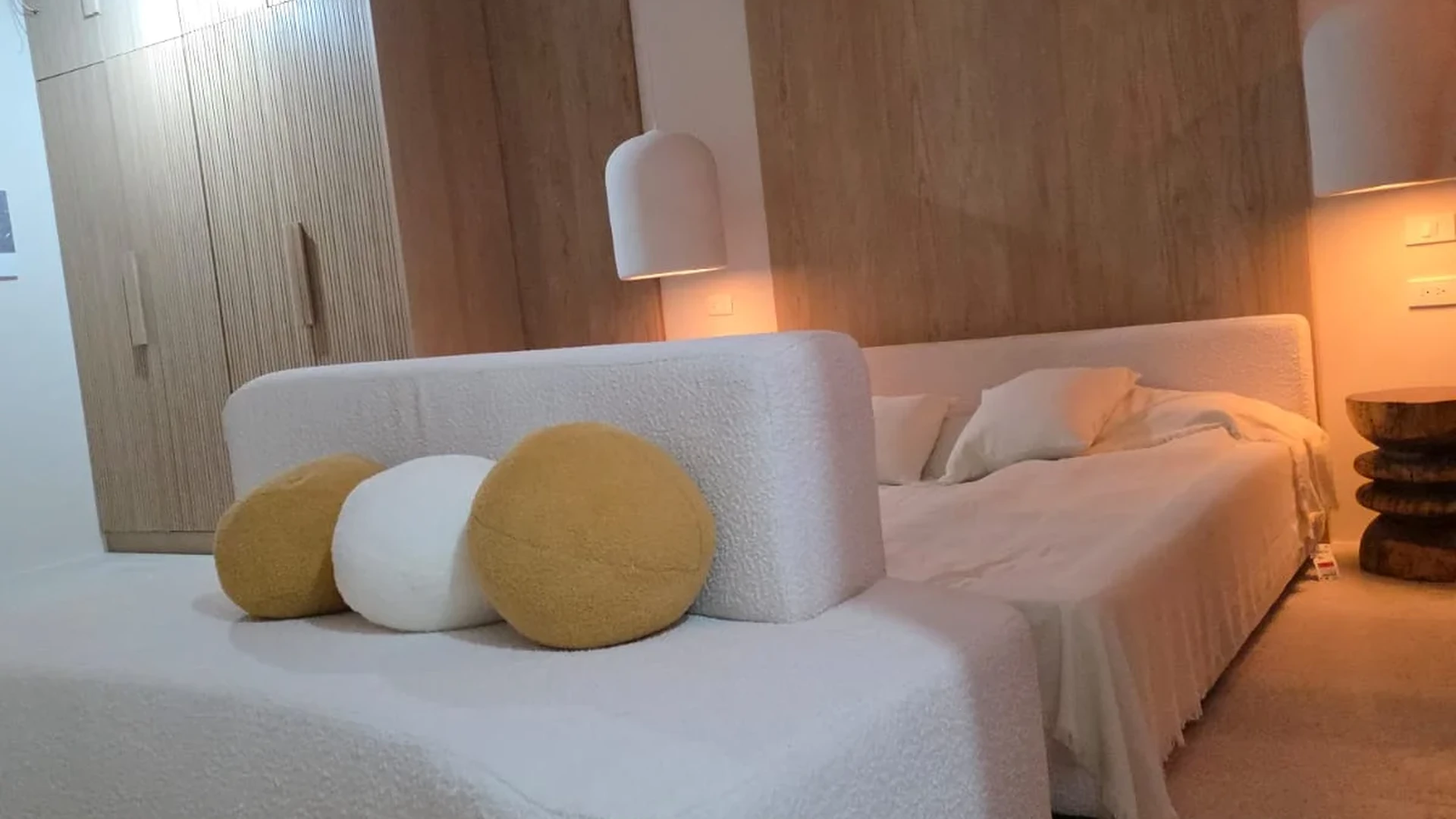 Image of a Modern Bedroom, featuring Wood Accent Wall and Built-in Wardrobe.