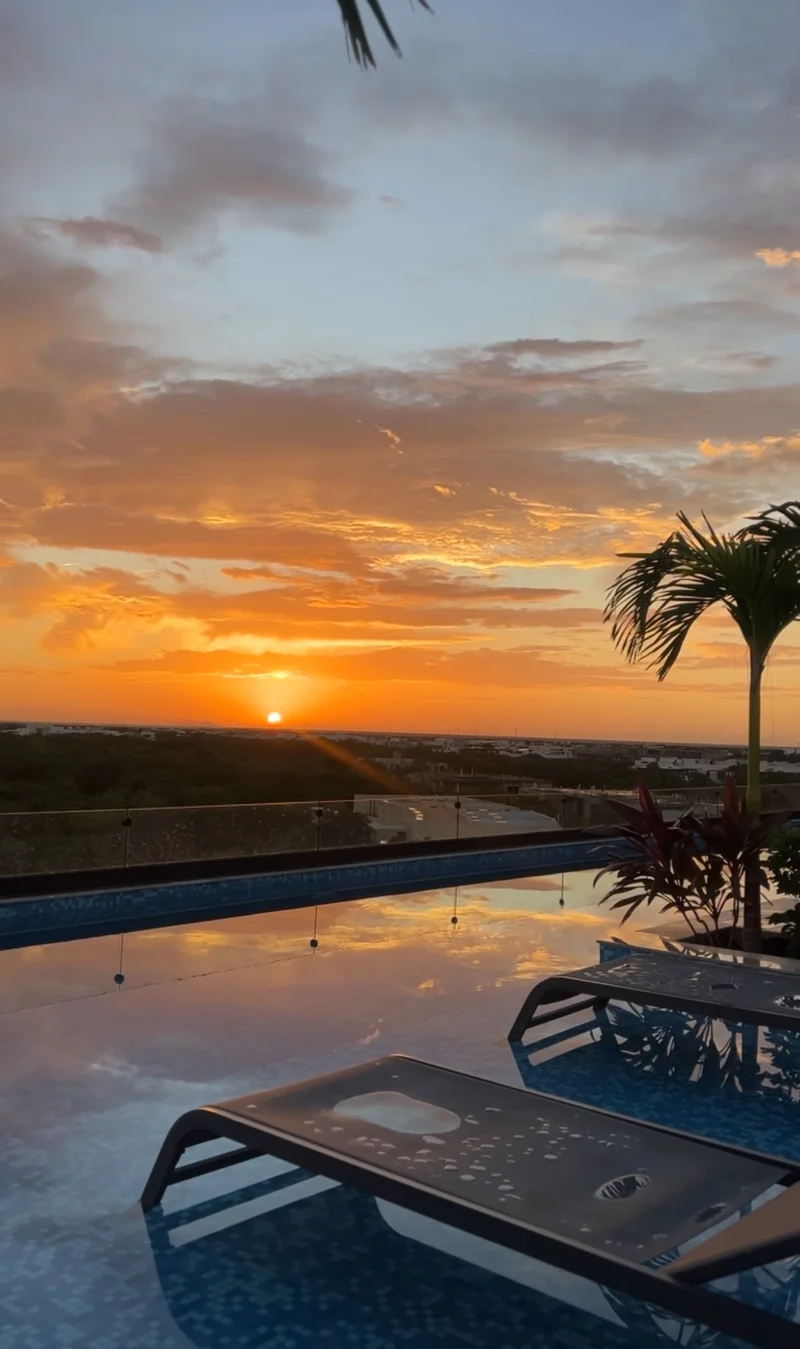 Image of a Rooftop Terrace, featuring Infinity Pool and Sunset View.