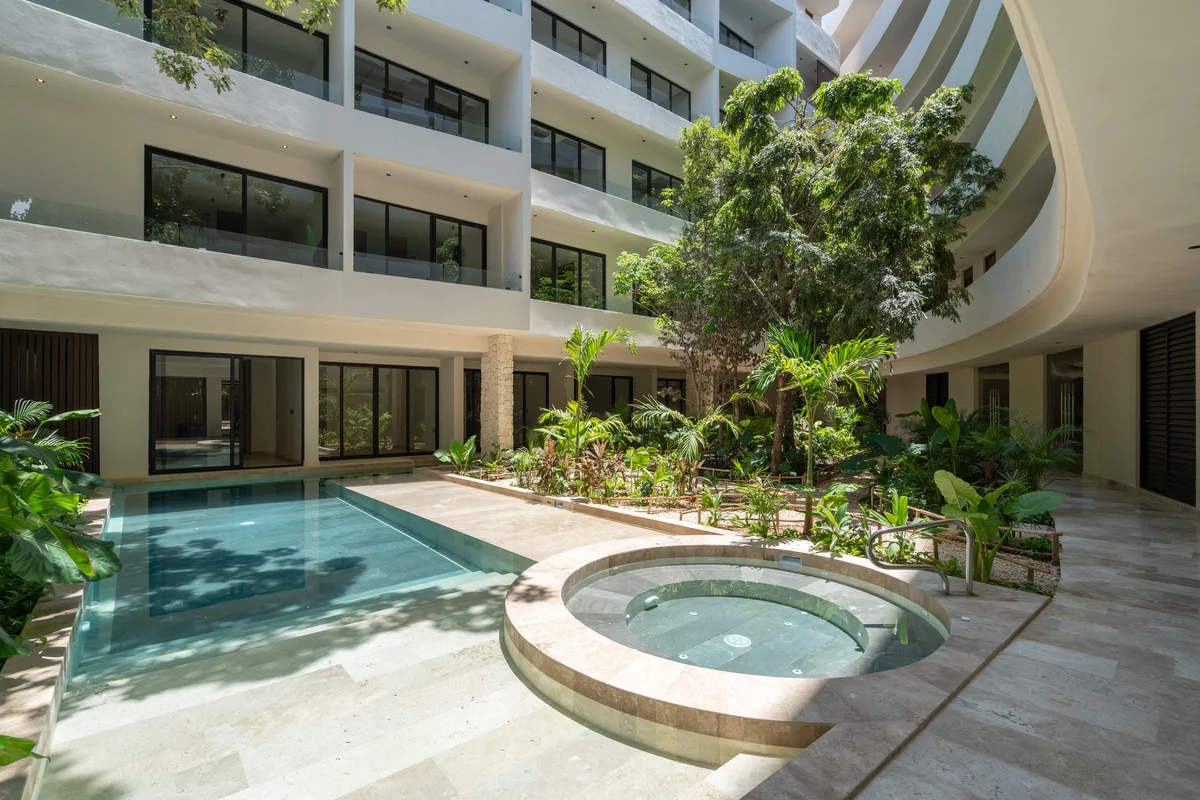 Image of a Resort Style Pool, featuring Tropical Courtyard and Modern Condominium.