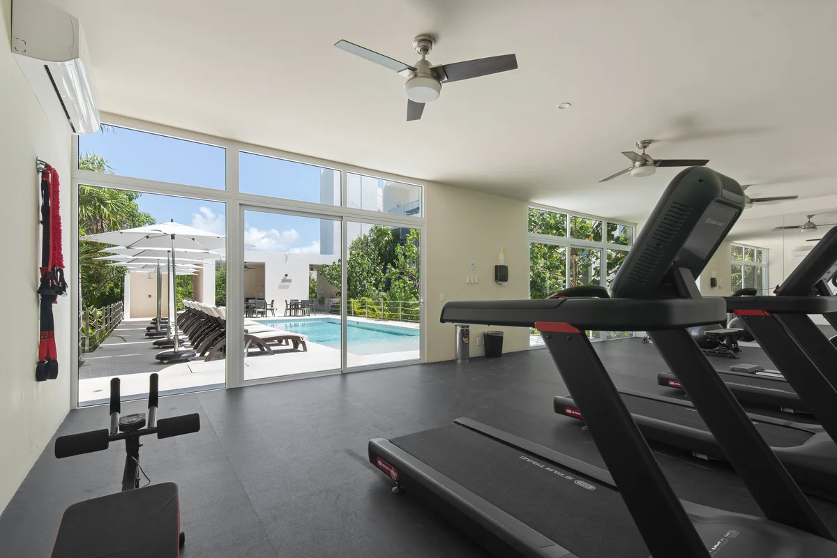 Image of a Fitness Center, featuring Pool View Gym and Indoor-Outdoor Flow.