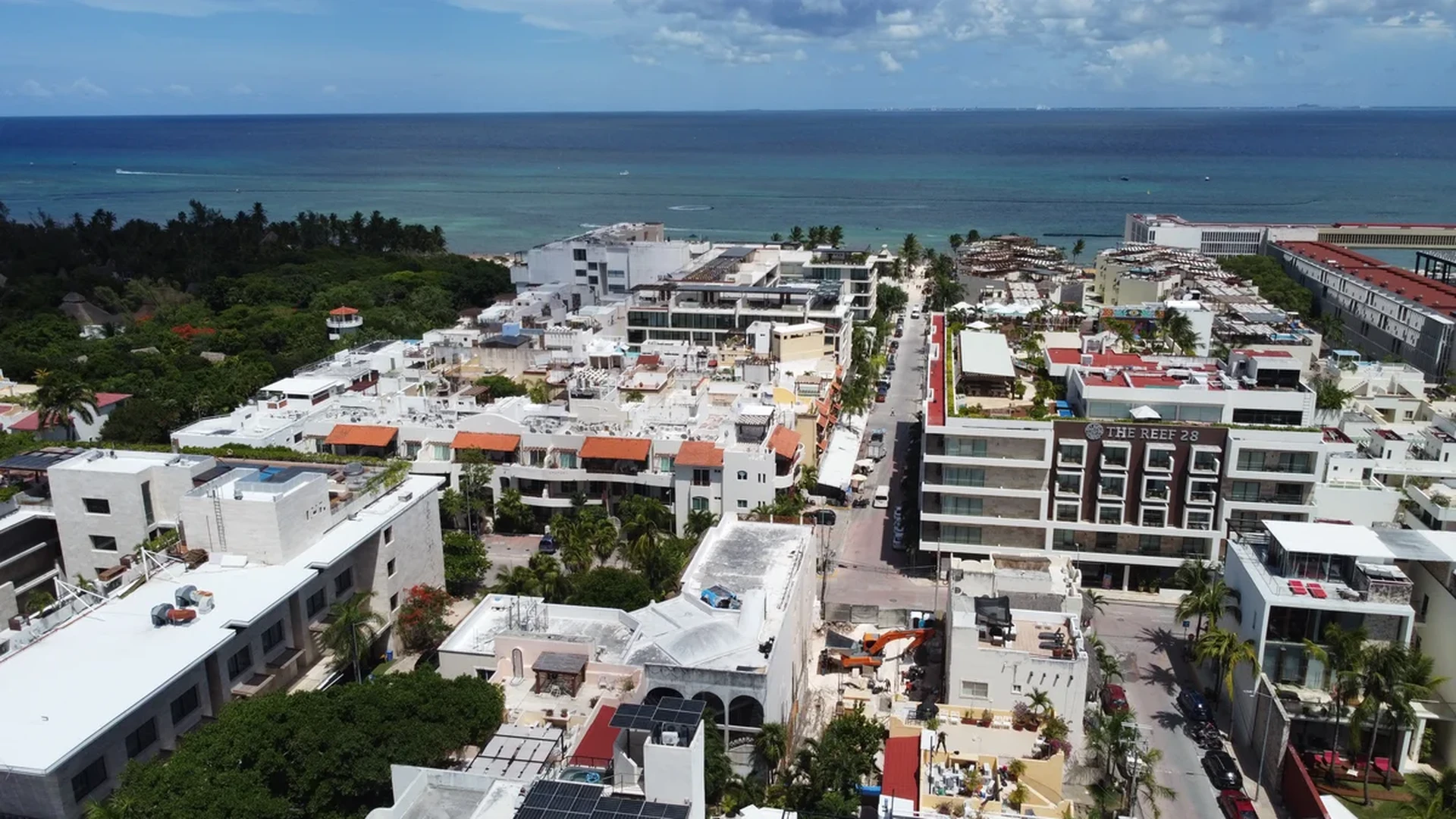 Image of a Aerial View, featuring Oceanfront Cityscape and Rooftop Pools.