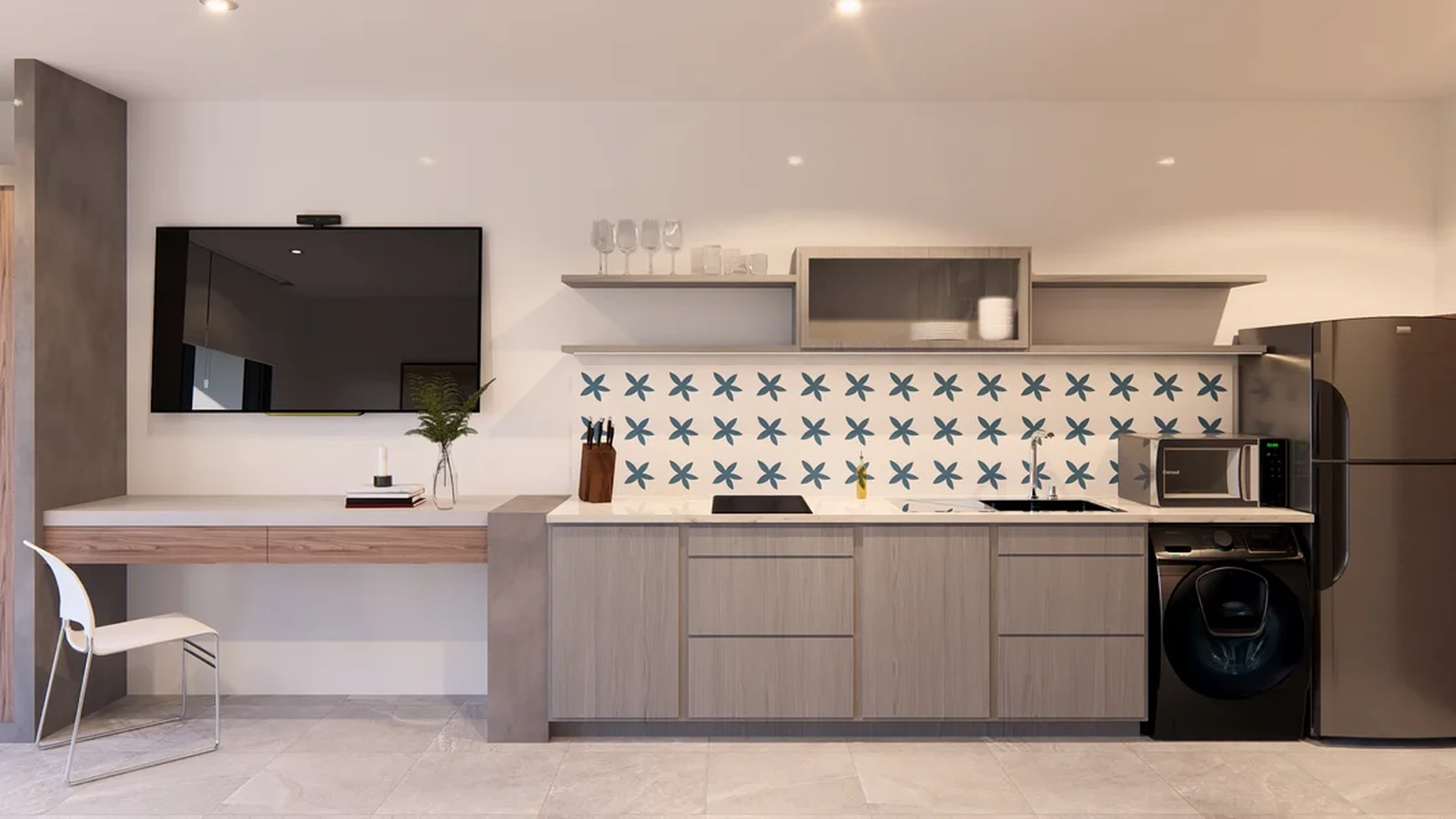 Image of a Modern Kitchenette, featuring Stainless Steel Appliances and In-Unit Laundry.
