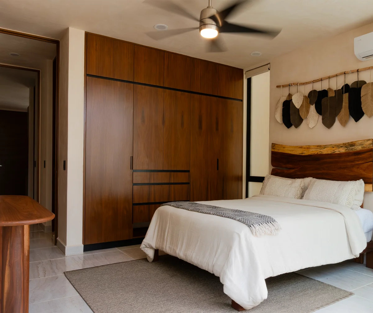 Image of a Primary Bedroom, featuring Built-in Wardrobe and Live-Edge Headboard.