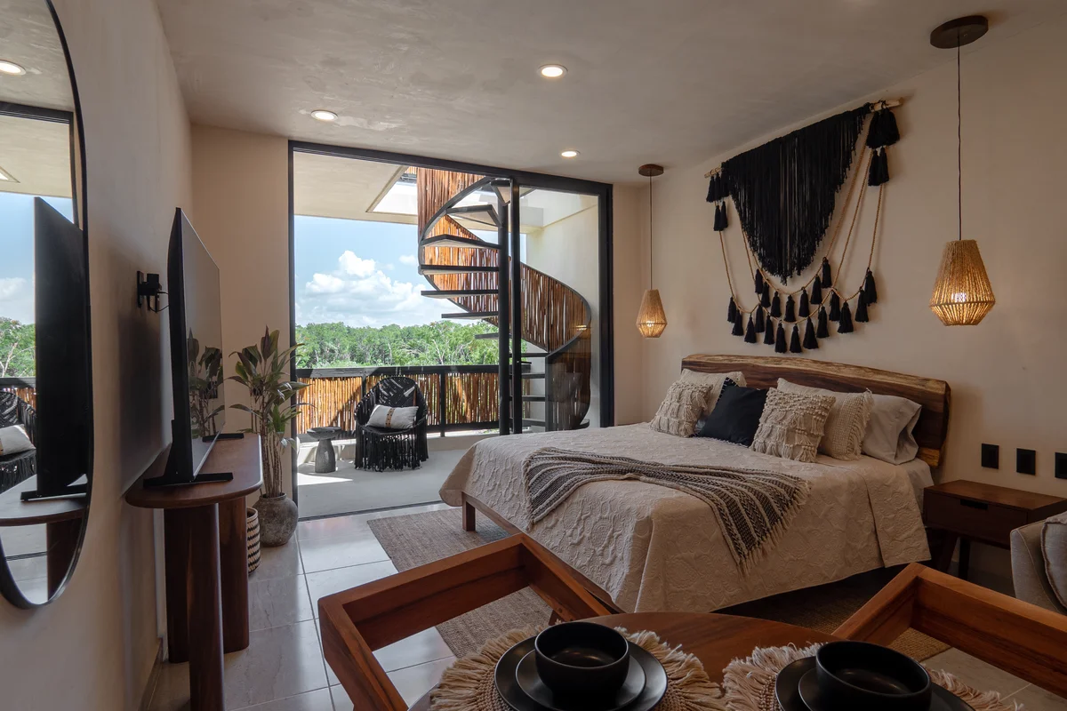 Image of a Bedroom Suite, featuring Private Balcony and Spiral Staircase.