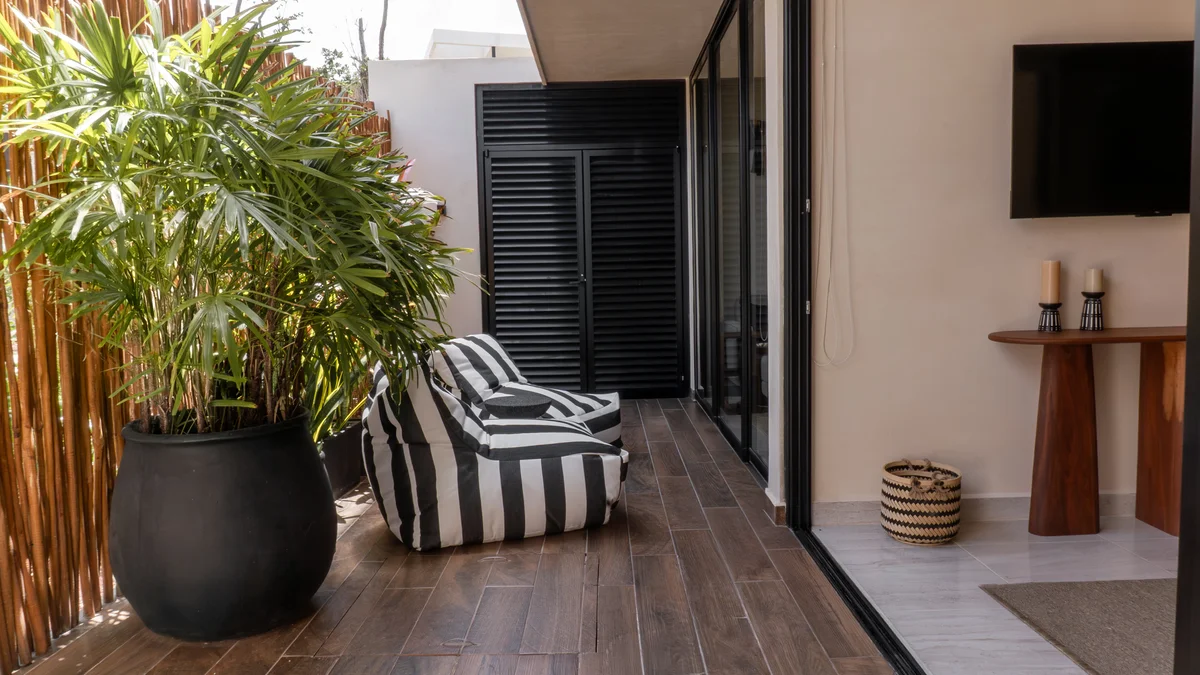 Image of a Private Patio, featuring Indoor-Outdoor Living and Wood-Look Tile Decking.