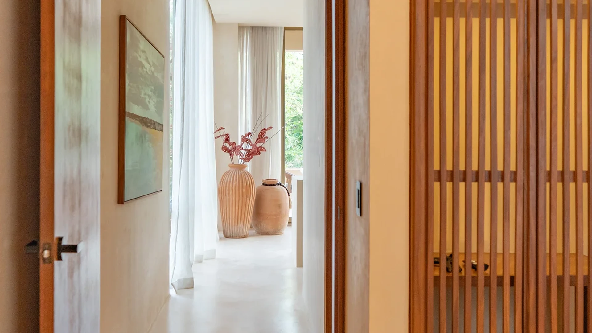 Image of a Modern Hallway, featuring Wooden Slatted Wall and Natural Wood Accents.