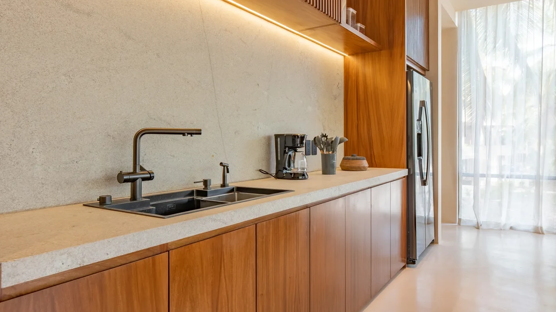 Image of a Modern Kitchen, featuring Wood Cabinetry and Stone Countertops.