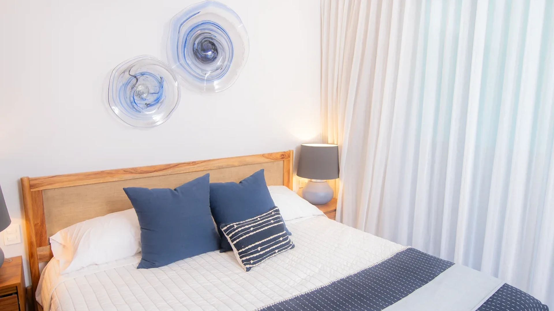 Image of a Bright Bedroom, featuring Air Conditioning and Modern Ceiling Fan.