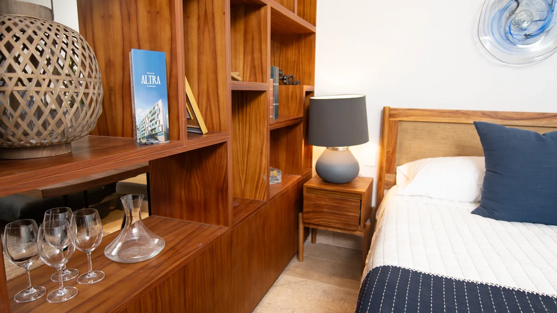 Image of a Bedroom, featuring Built-in Wood Cabinetry and Stone Tile Flooring.