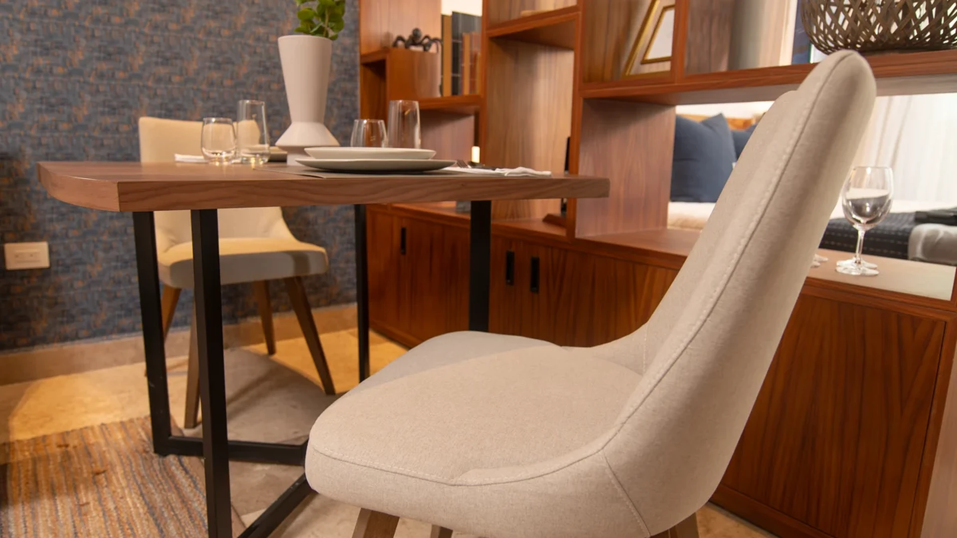Image of a Dining Area, featuring Wood Shelving Unit and Modern Interior.