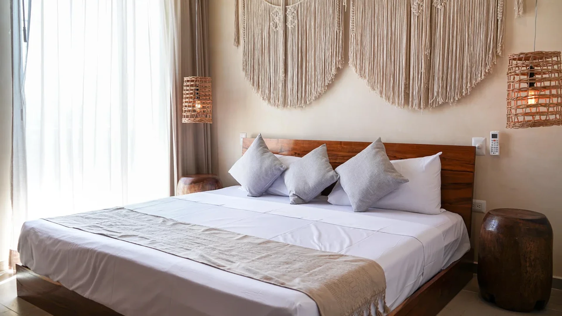 Image of a Bohemian Style Bedroom, featuring Macrame Wall Decor and Wicker Pendant Lights.