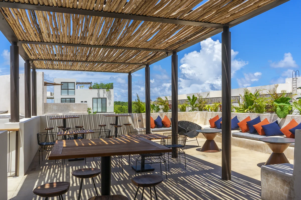 Image of a Rooftop Terrace, featuring Outdoor Lounge and Shaded Pergola.