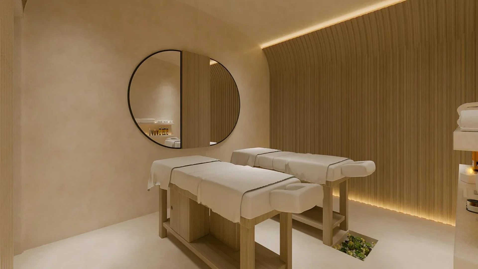 Image of a Spa Treatment Room, featuring Wellness Suite and Couples Massage Tables.