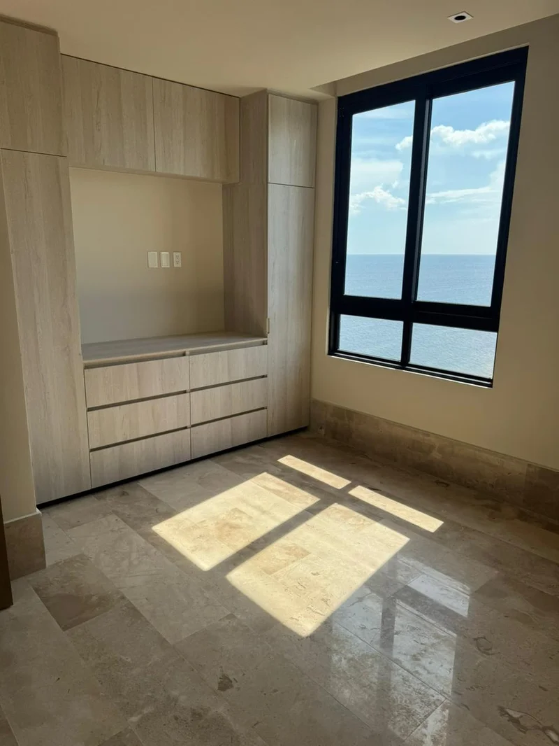 Image of a Bedroom, featuring Ocean View and Built-in Cabinetry.