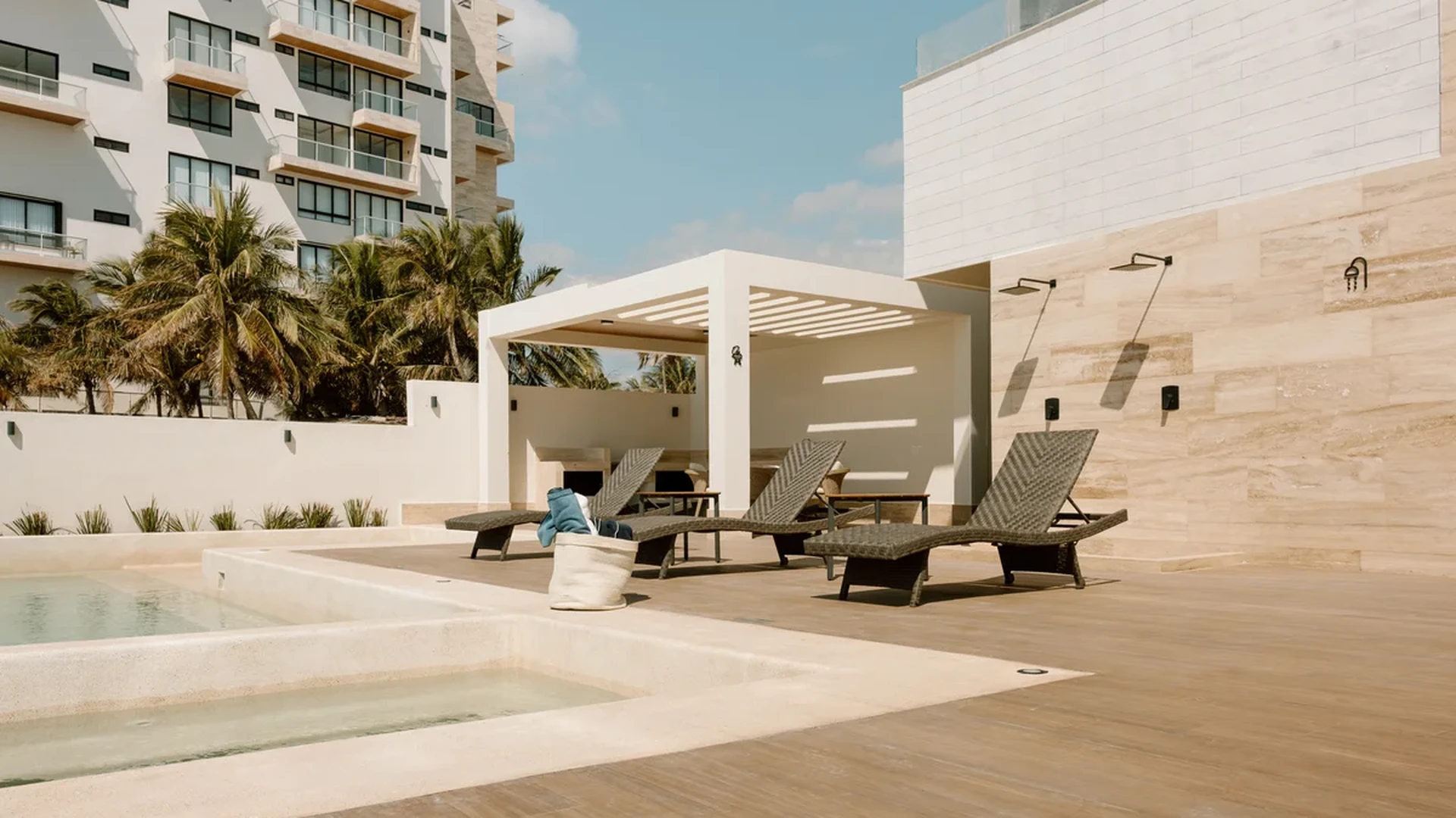 Image of a Sundeck, featuring Resort-Style Pool and Outdoor Lounge.
