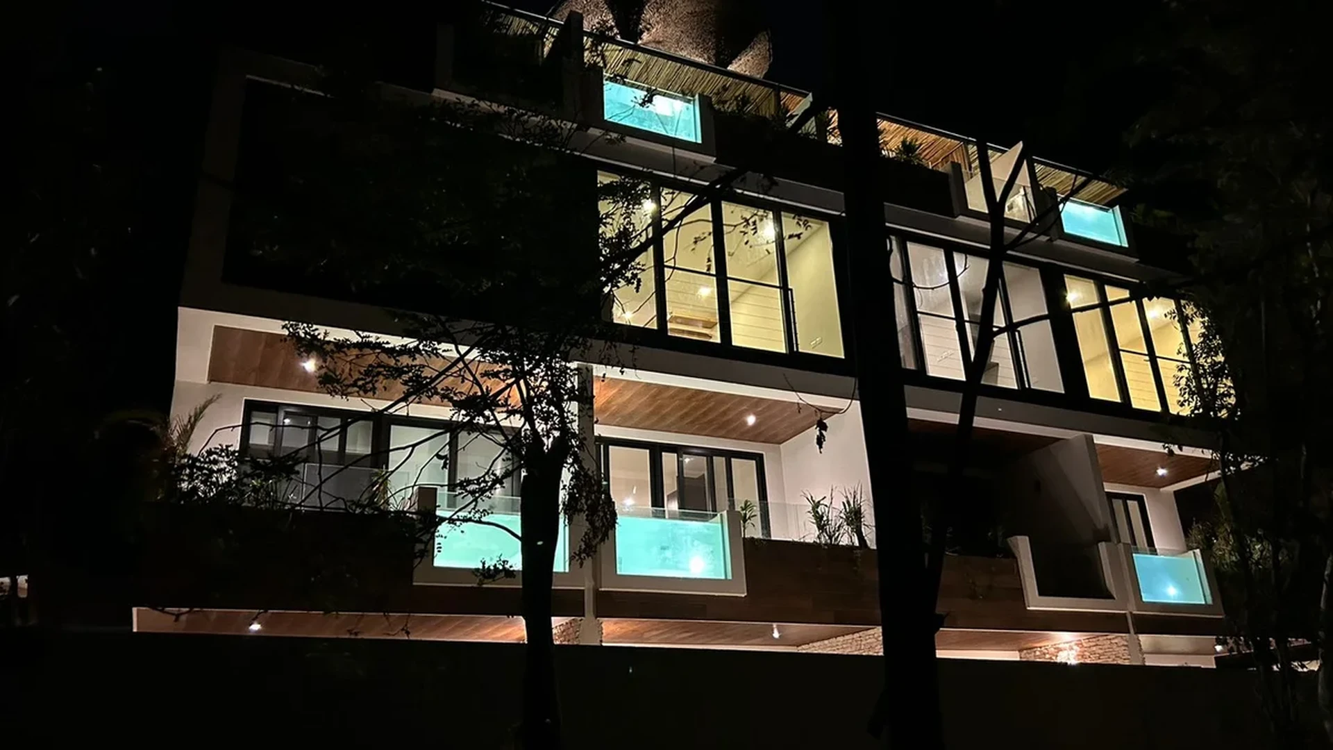 Image of a Modern Architecture, featuring Private Plunge Pools and Nighttime Illumination.