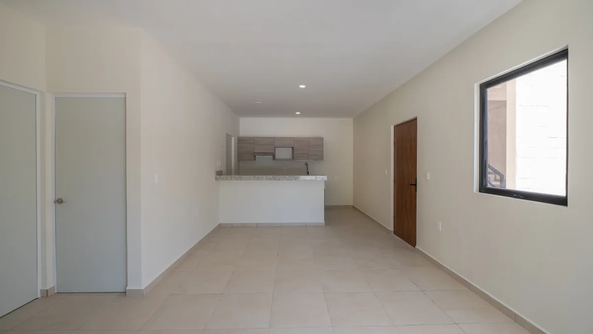 View of Open Concept Living at Selva Escondida II, showcasing Tiled Flooring, Modern Kitchenette.