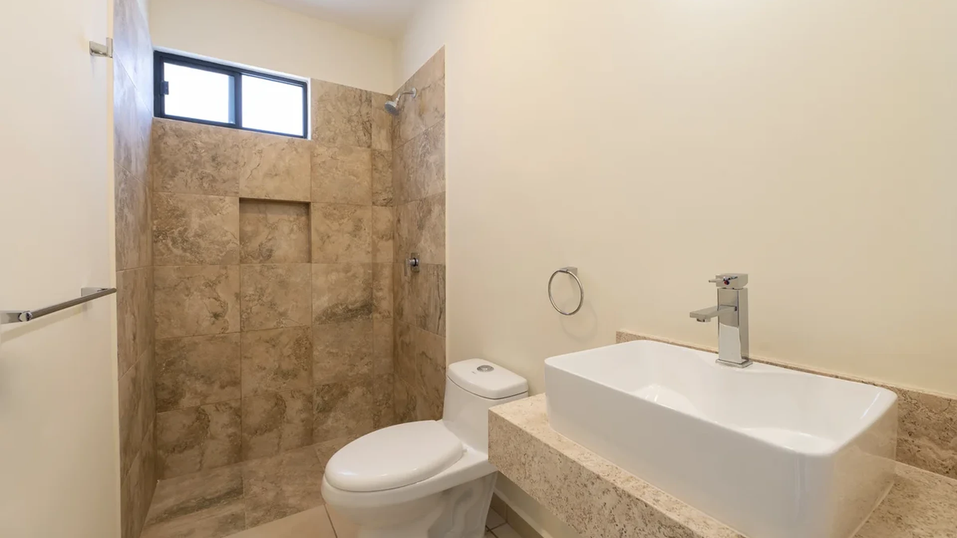 View of Modern Bathroom at Selva Escondida II, showcasing Tiled Shower, Vessel Sink.