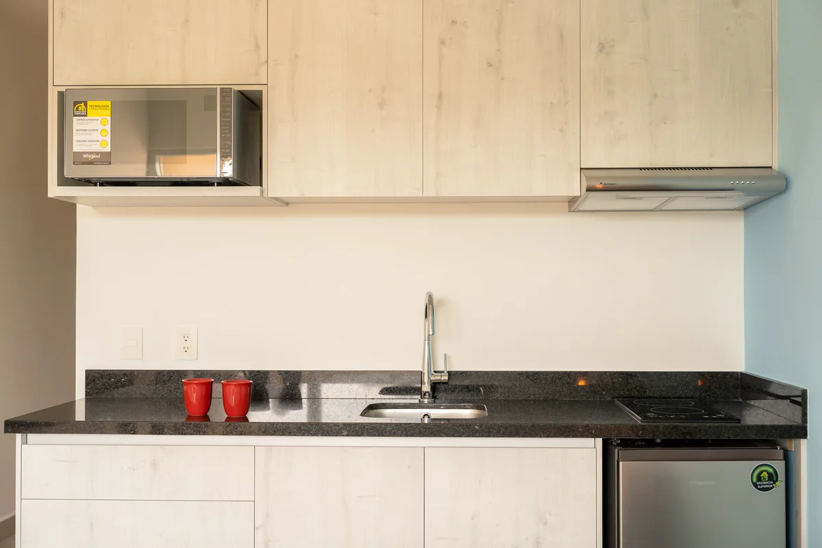View of Kitchenette at Tao Nautico, showcasing Modern Kitchen, Granite Countertops.