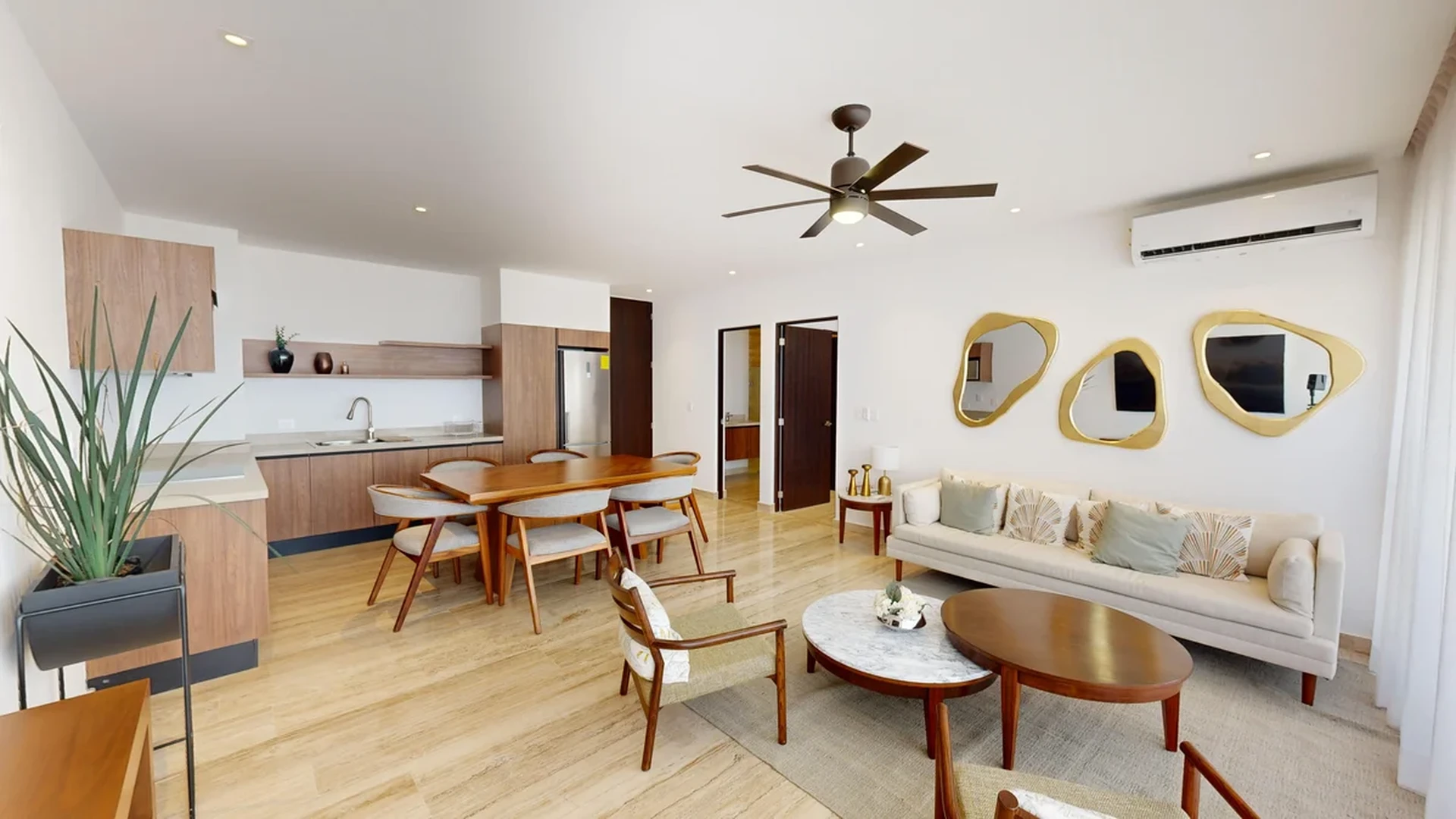 View of Open Concept Living at Ceiba at 25, showcasing Living and Dining Area, Modern Interior.