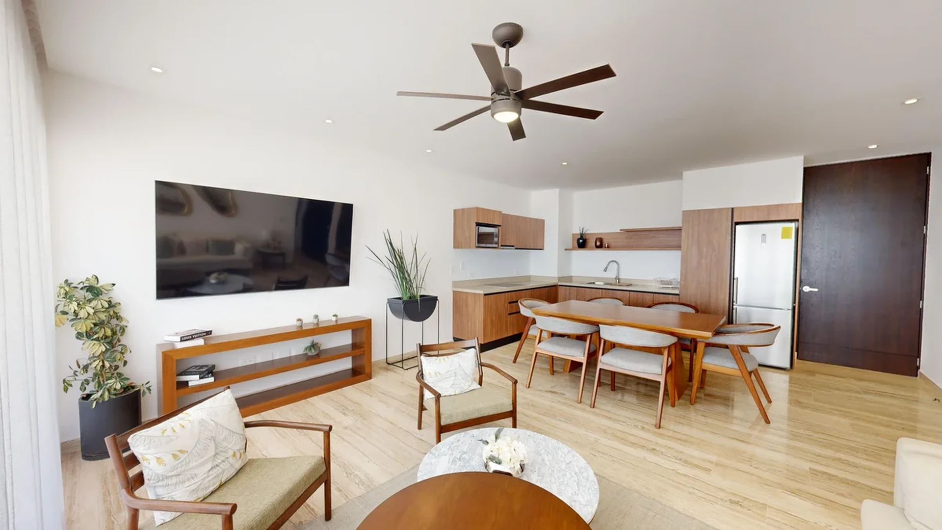 View of Open Concept Living at Ceiba at 25, showcasing Modern Kitchen, Living and Dining Area.