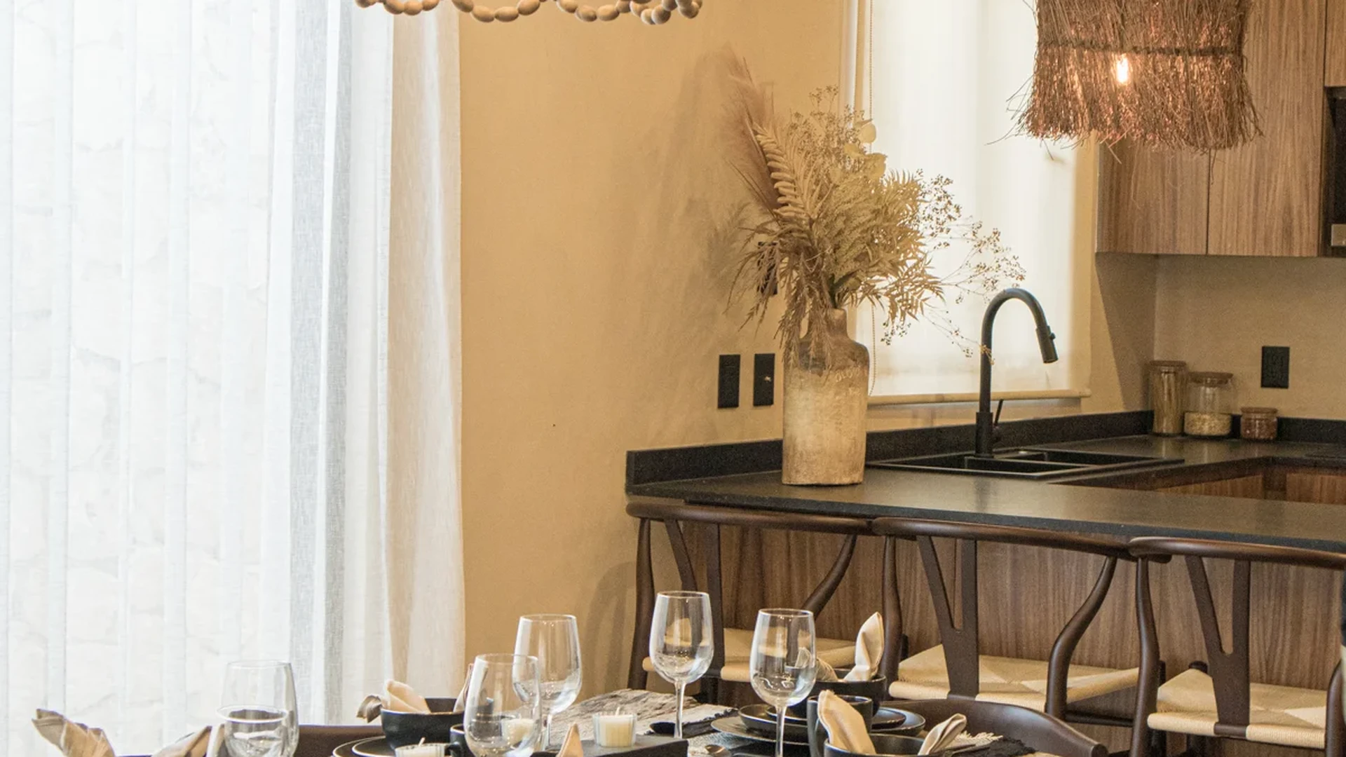 View of Dining Room at Le Reve Cenote, showcasing Open Concept Kitchen, Rustic Design.