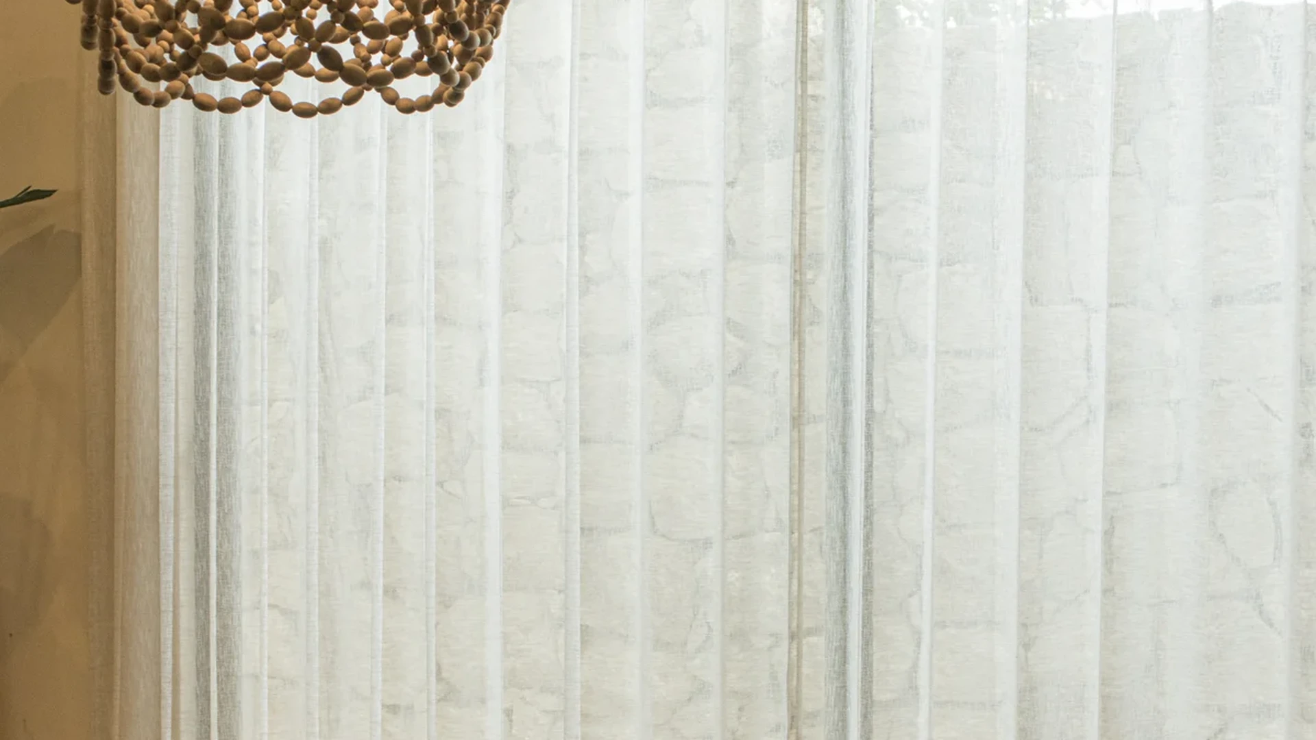 View of Dining Room at Le Reve Cenote, showcasing Rustic Dining Table, Statement Chandelier.