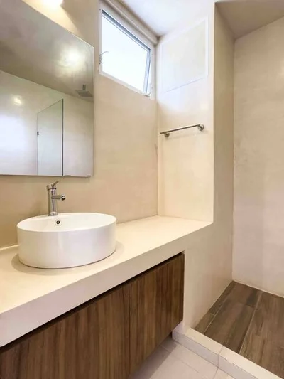 View of Modern Bathroom at Menotto 11, showcasing Vessel Sink, Floating Vanity.