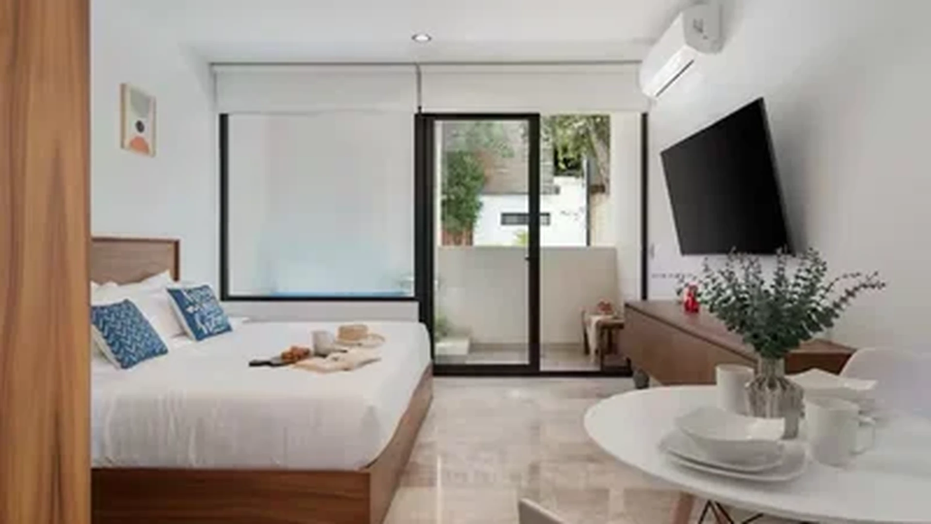 View of Studio Apartment at Akua Reserve, showcasing Modern Bedroom, Minimalist Decor.