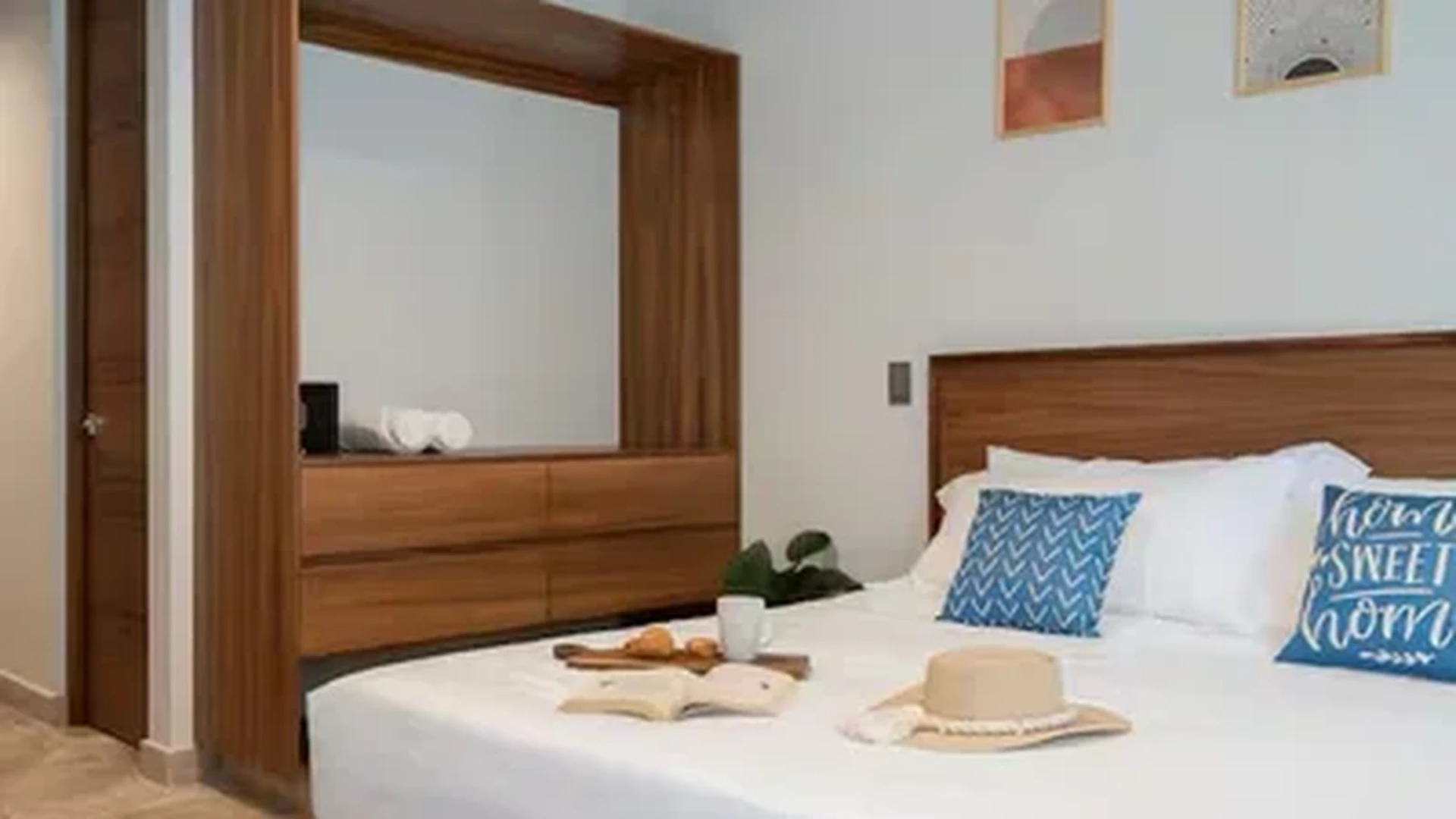View of Bedroom at Akua Reserve, showcasing Modern Furniture, Wood Headboard.
