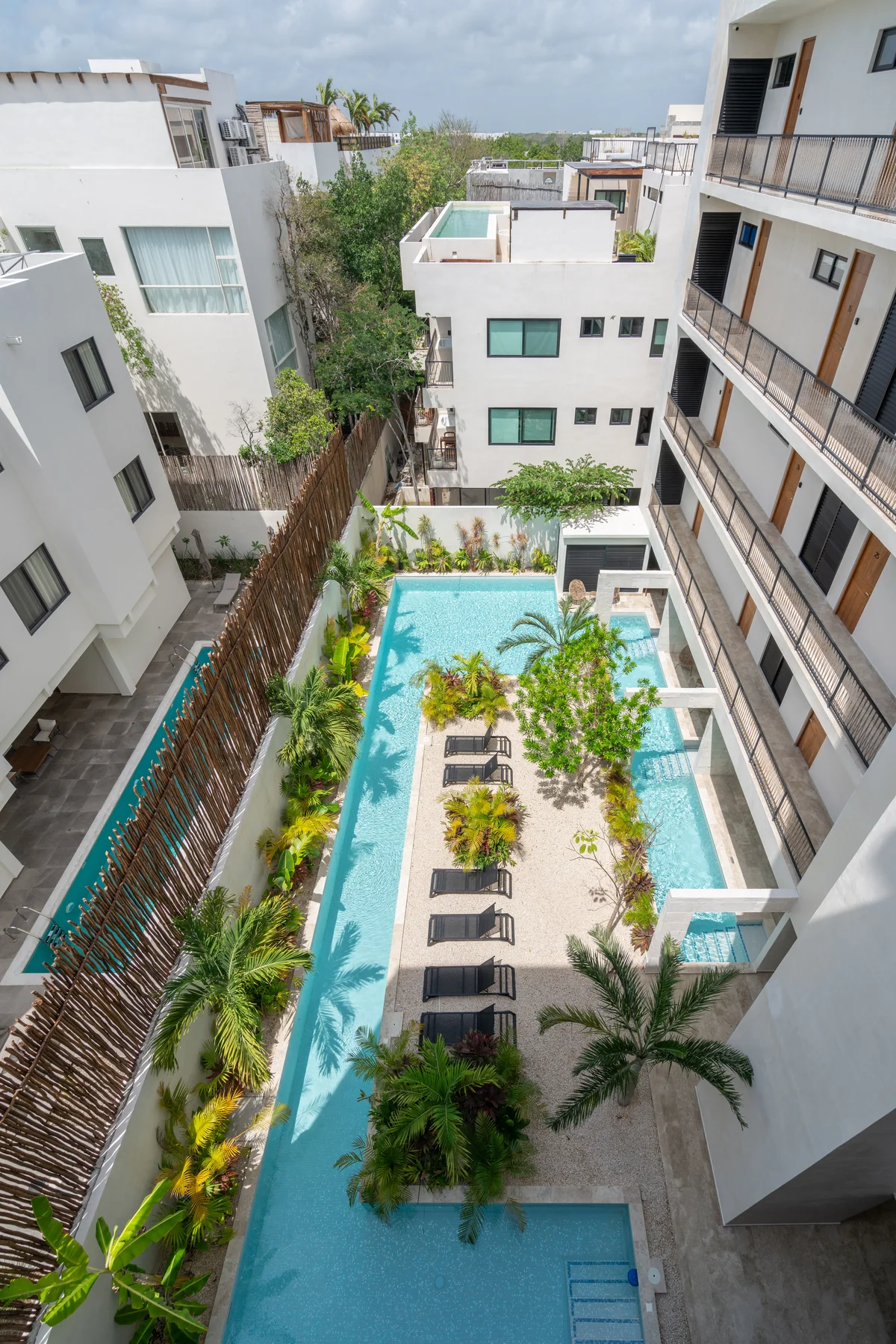 Image of Swimming Pool at Akua Reserve, featuring Resort-style Pool, Modern Apartment Complex.