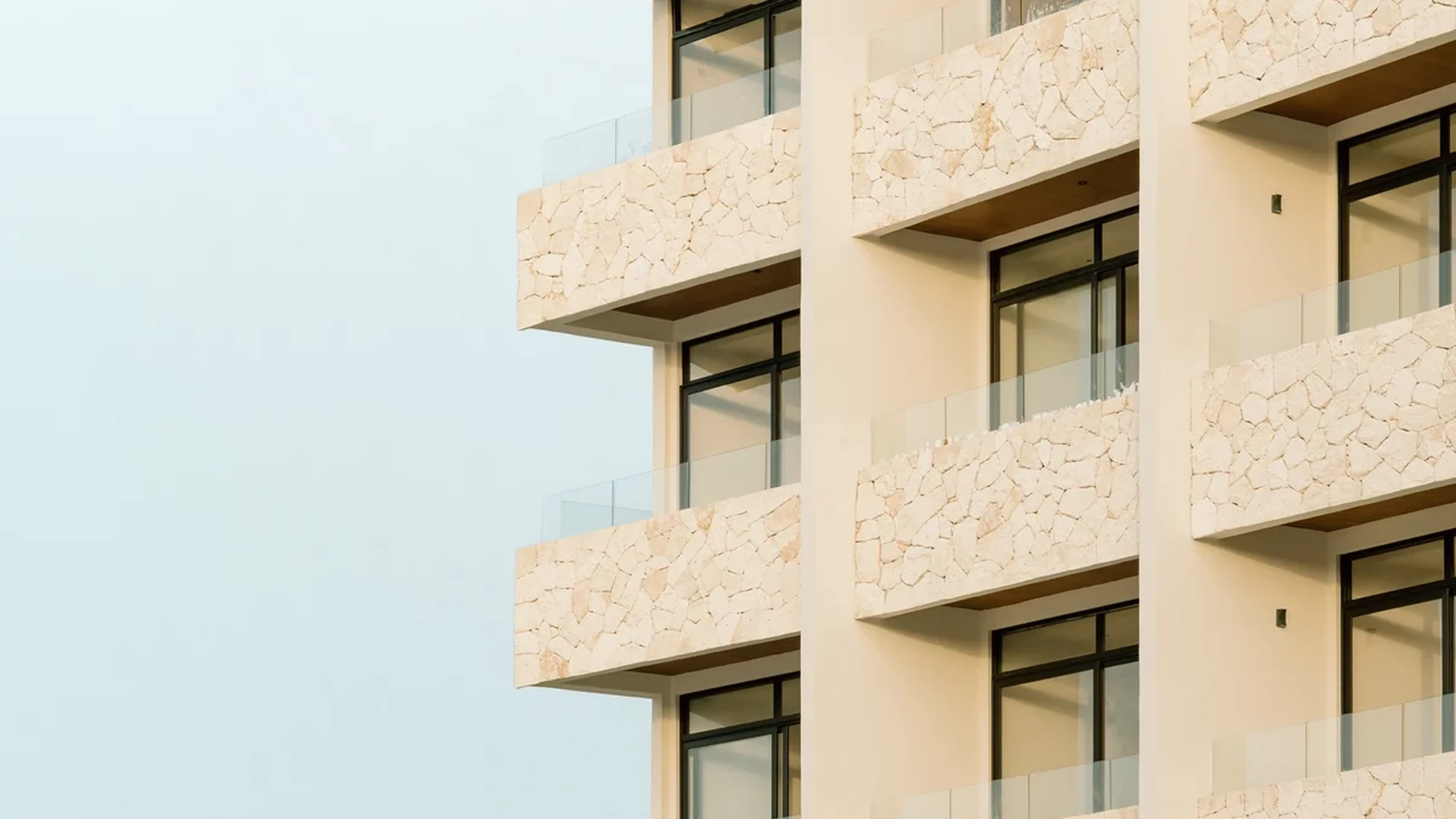 View of Modern Architecture at Distrito Norte, showcasing Apartment Building, Stone Facade.