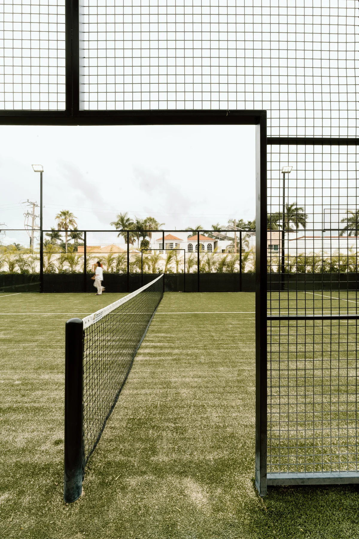 View of Padel Court at Distrito Norte, showcasing Tennis Court, Outdoor Amenity.