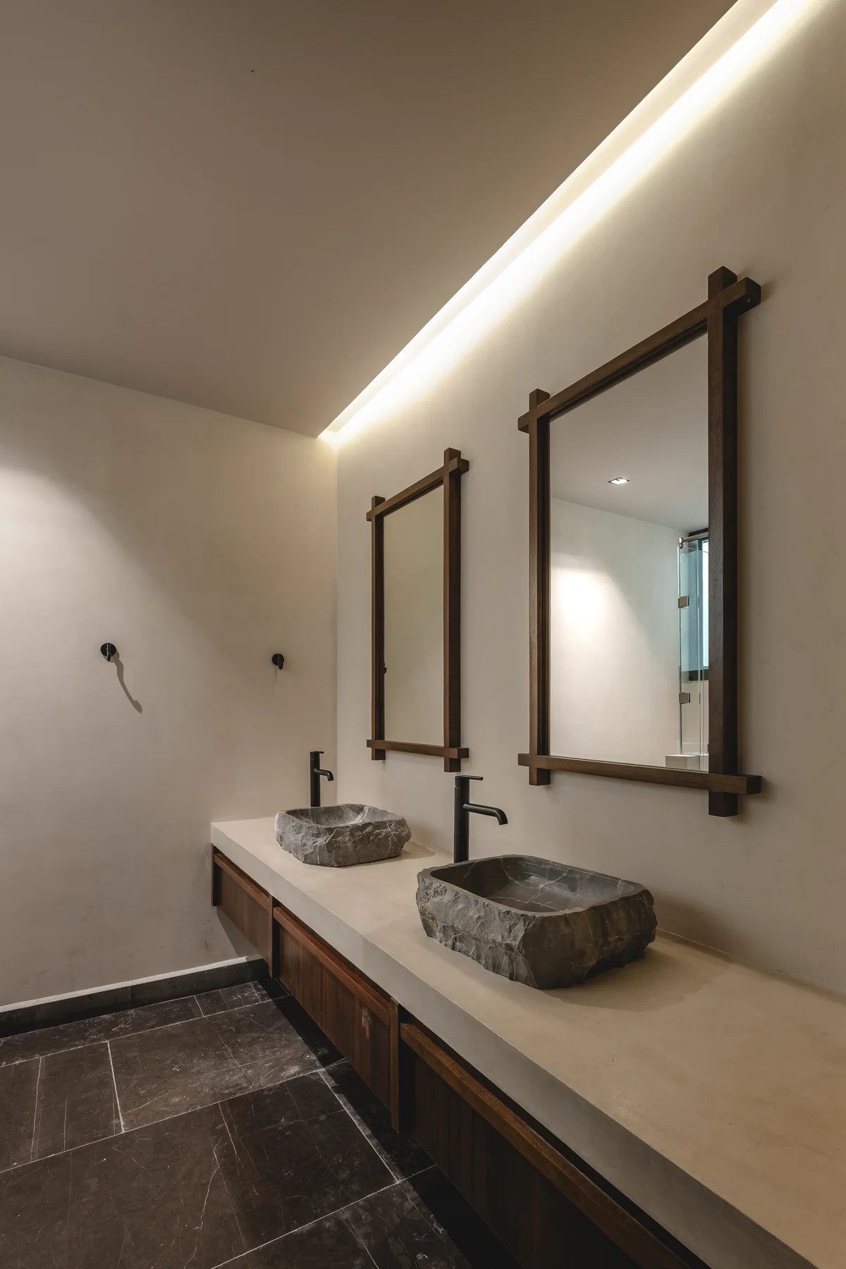 View of Modern Bathroom at Humana, showcasing Double Vanity, Stone Vessel Sinks.