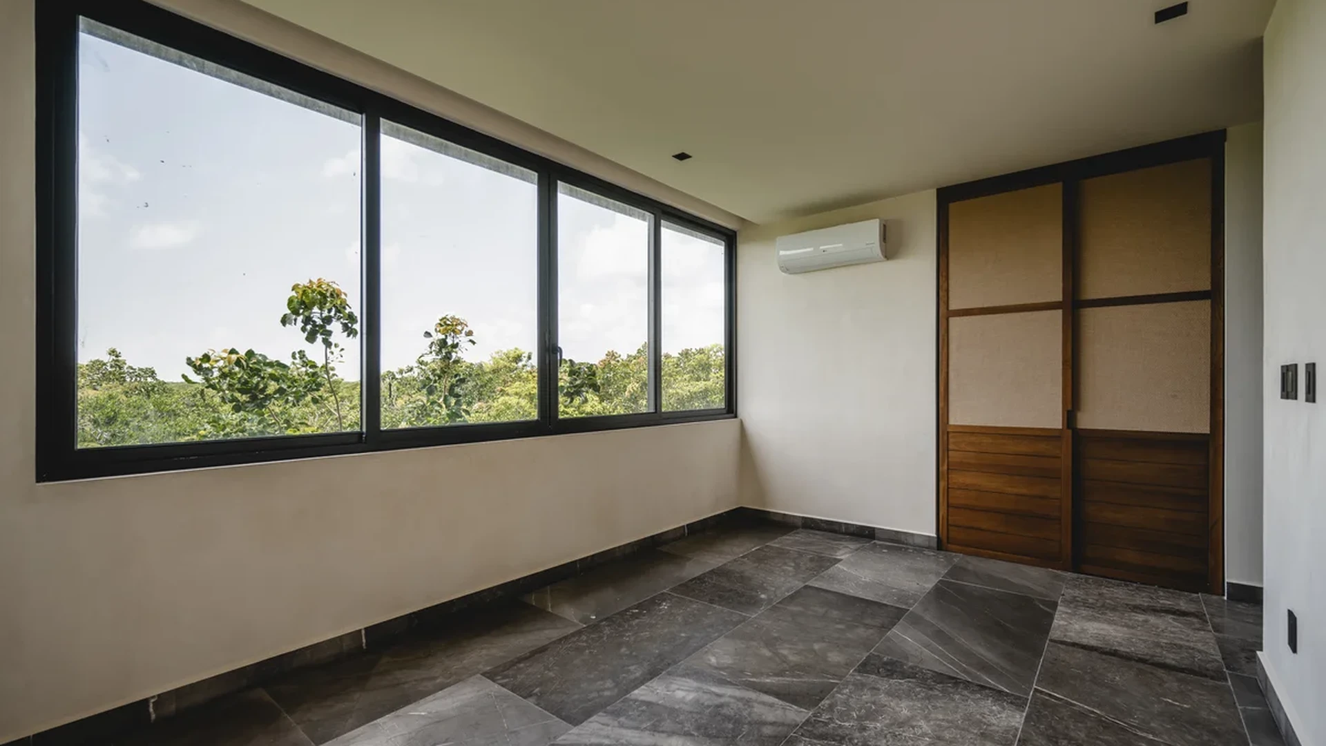 View of Unfurnished Room at Humana, showcasing Marble Tile Flooring, Large Windows.