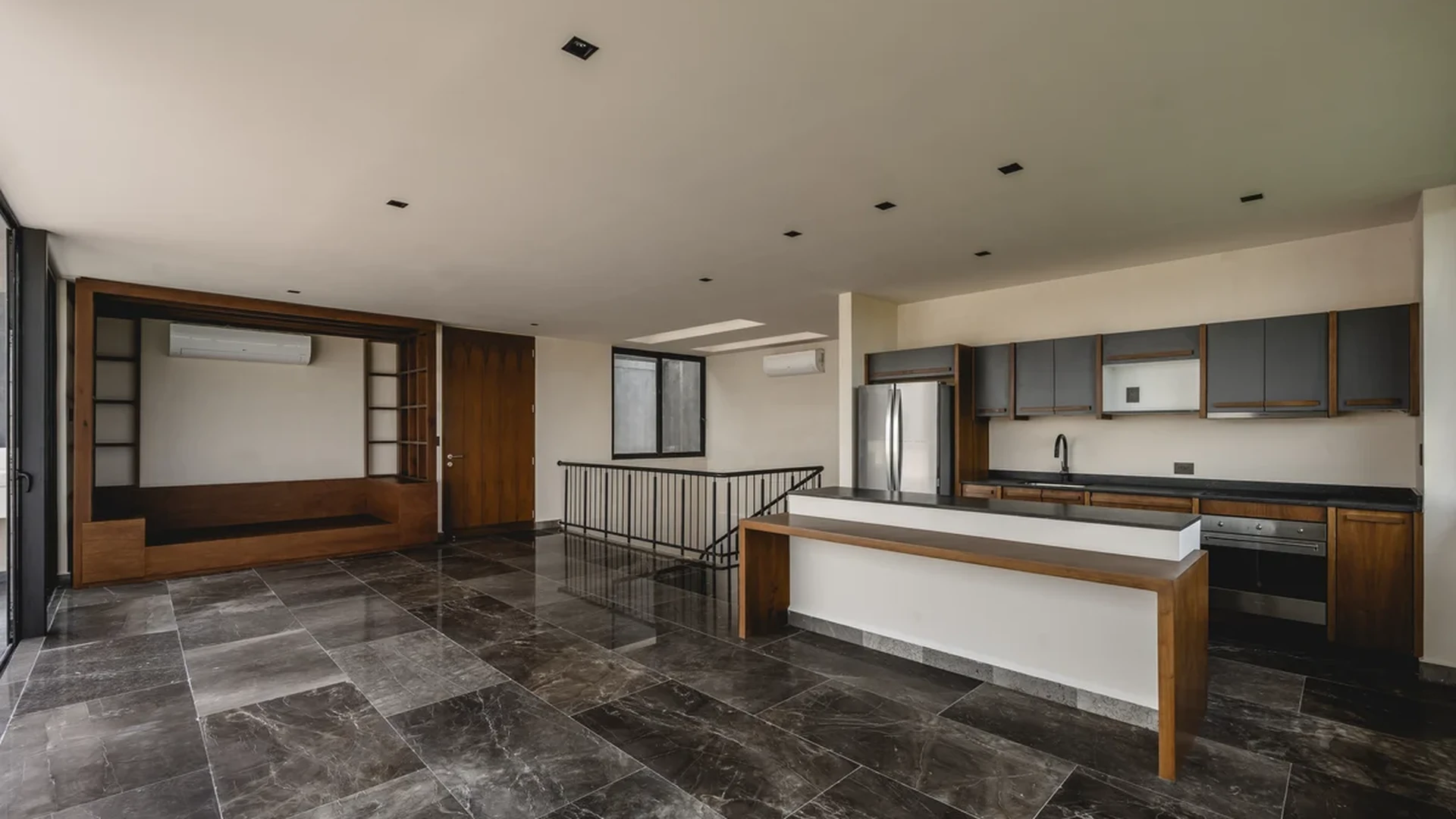 View of Open Concept Living at Humana, showcasing Modern Kitchen, Marble Flooring.