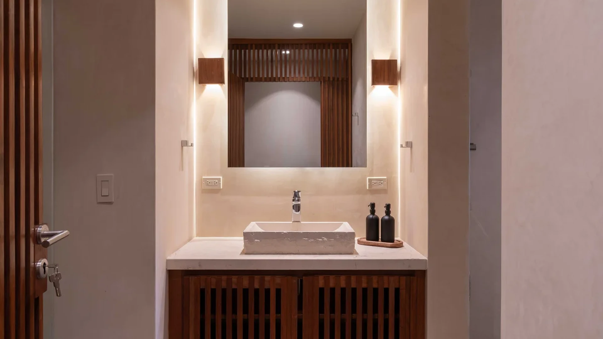 View of Modern Bathroom at Miraluna, showcasing Wood Vanity, Vessel Sink.